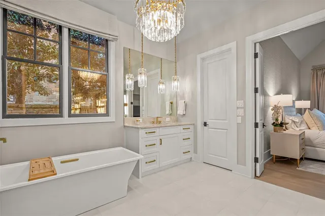a bathroom with a double vanity sink mirror and shower