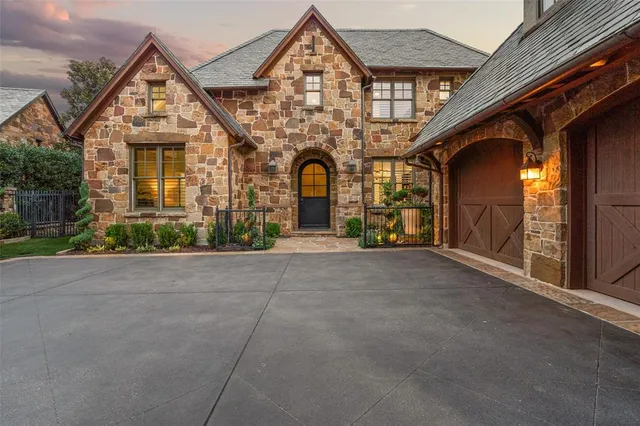 a view of a hallway with wooden floor and entryway