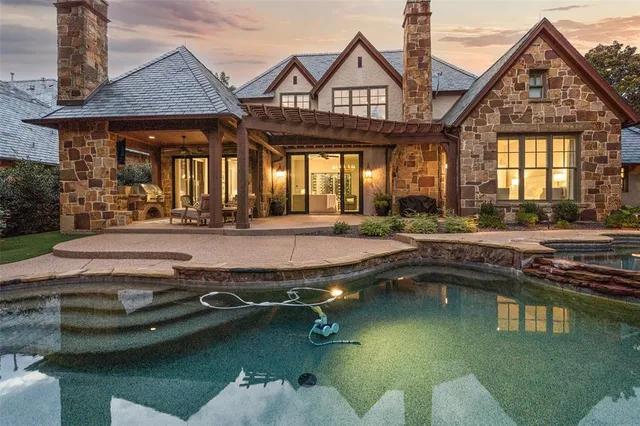 a front view of a house with a yard table and chairs