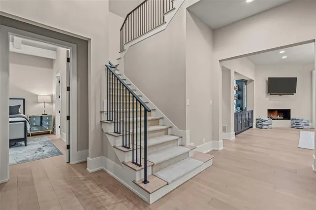 a living room with furniture and chandelier