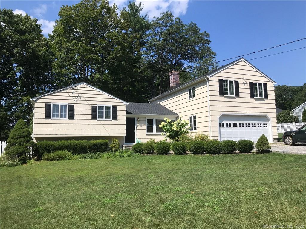 12 Cranberry Lane Ridgefield, CT 06877 - Photo 1 of 1 a front view of a house with a yard
