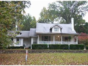 2501 Sharon Road Charlotte, NC 28211 - Photo 1 of 1 a front view of a house with garden