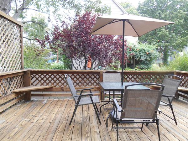 a view of a chairs and table on the wooden floor