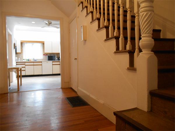 52 Meacham Road, Unit 52 Somerville, MA 02144 - Photo 4 of 12 a view of a kitchen with wooden floor and a window