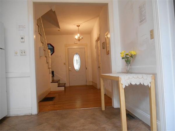 52 Meacham Road, Unit 52 Somerville, MA 02144 - Photo 5 of 12 a view of a hallway to rooms and wooden floor