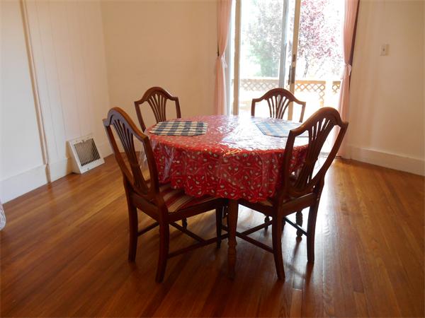 52 Meacham Road, Unit 52 Somerville, MA 02144 - Photo 7 of 12 a view of a dining room with furniture window and wooden floor