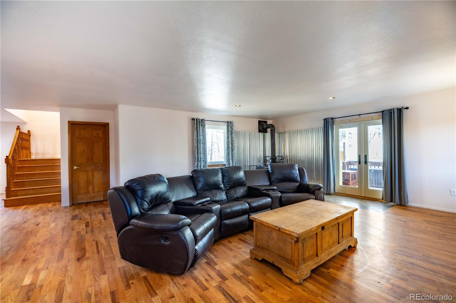 109 Heide Road Shawnee, CO 80475 - Photo 12 of 26 a living room with furniture and wooden floor