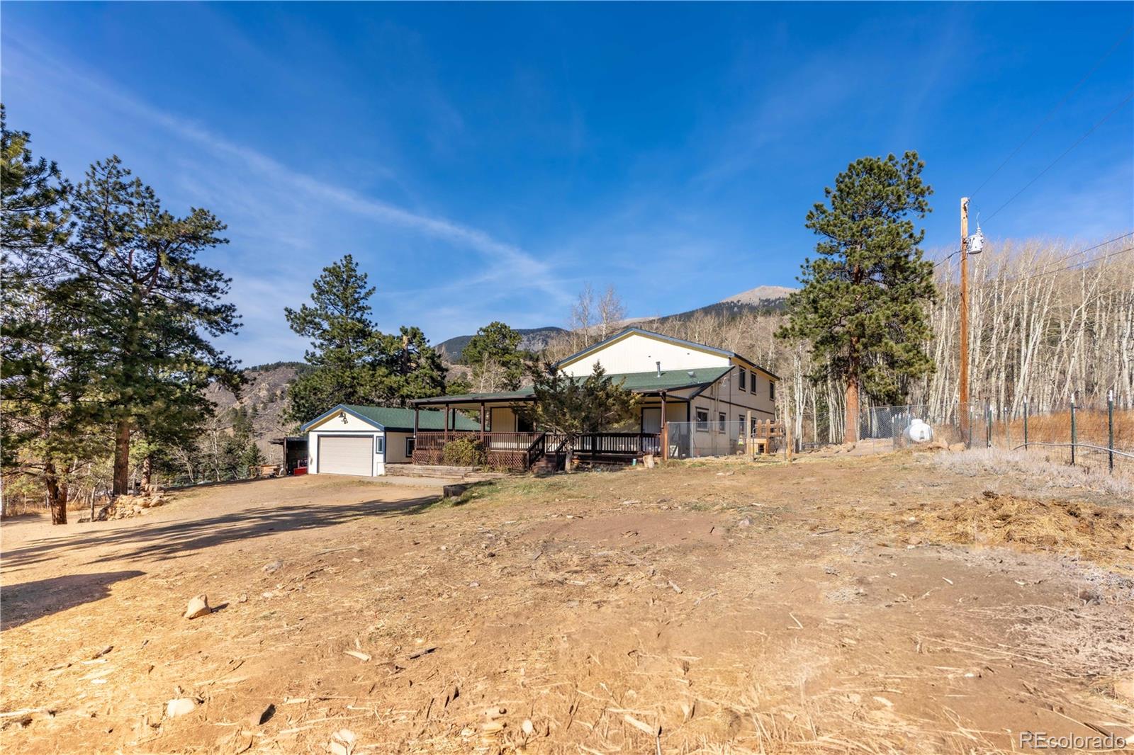 109 Heide Road Shawnee, CO 80475 - Photo 22 of 26 a view of a house with a snow in the yard