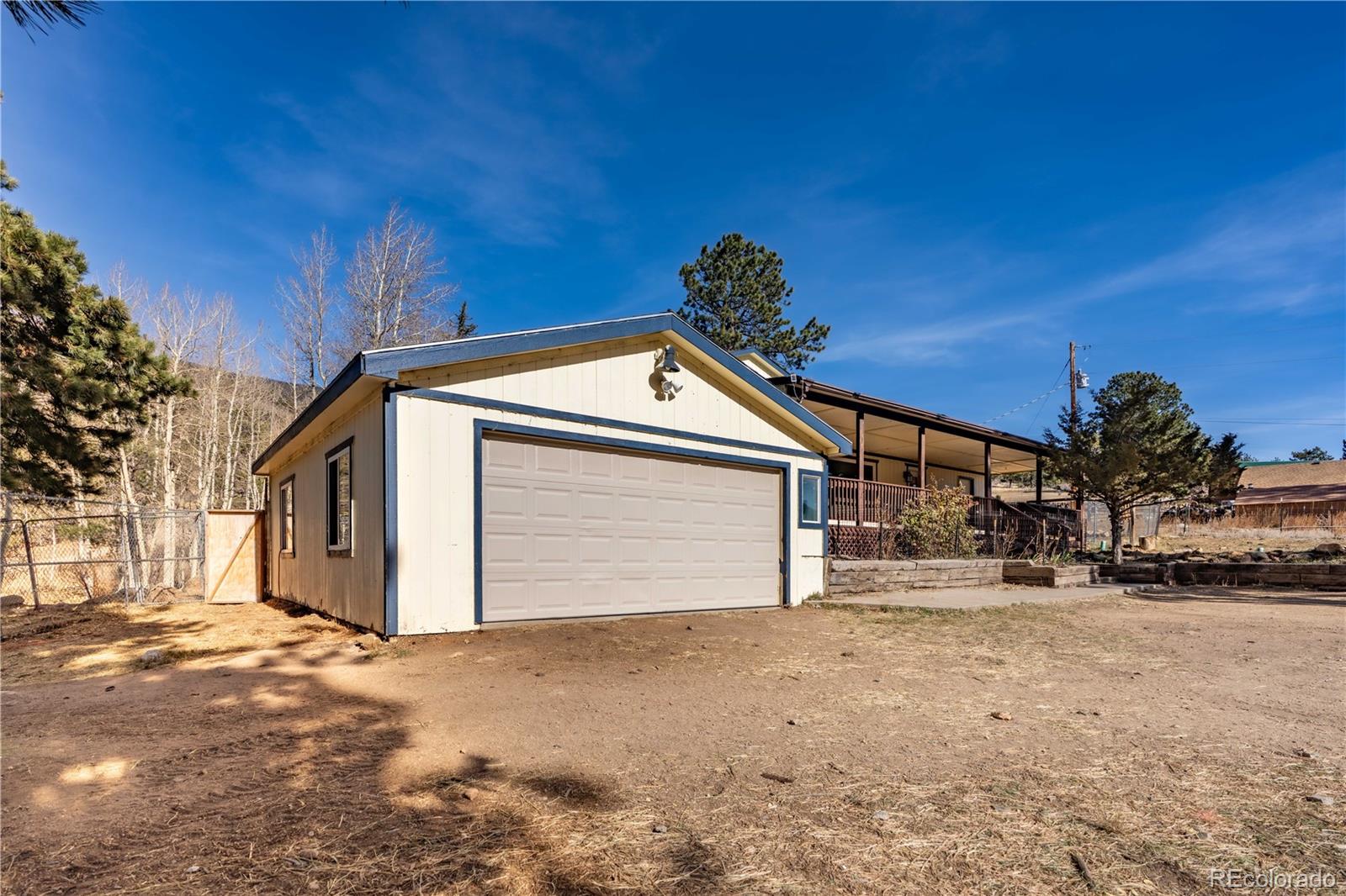 109 Heide Road Shawnee, CO 80475 - Photo 5 of 26 a front view of a house with a yard
