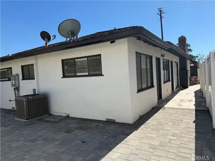 a view of a house with wooden deck