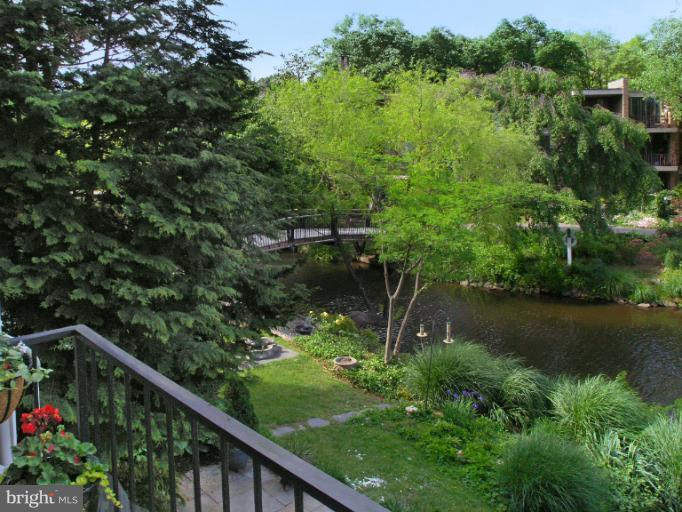 11438 Waterview Cluster Reston, VA 20190 - Photo 14 of 30 Historic Bridge across lake leads to plaza walks