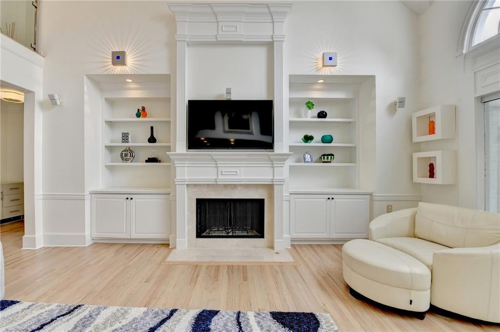 1830 Briergate Drive Duluth, GA 30097 - Photo 16 of 61 a living room with furniture a flat screen tv and a fireplace