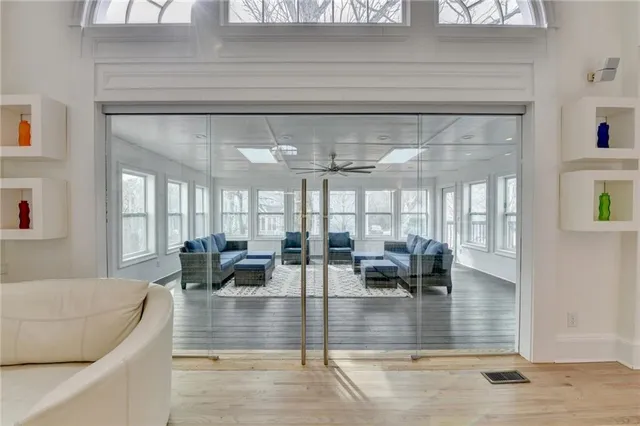 a spacious bedroom with a bed and a chandelier