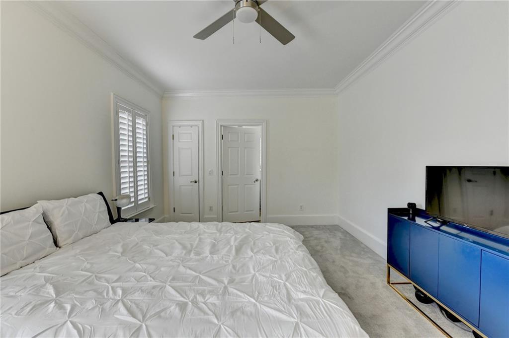 1830 Briergate Drive Duluth, GA 30097 - Photo 23 of 61 a bedroom with a bed and a flat screen tv