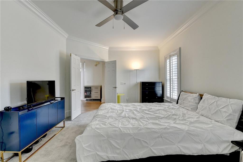 1830 Briergate Drive Duluth, GA 30097 - Photo 24 of 61 a bedroom with a bed and a flat screen tv