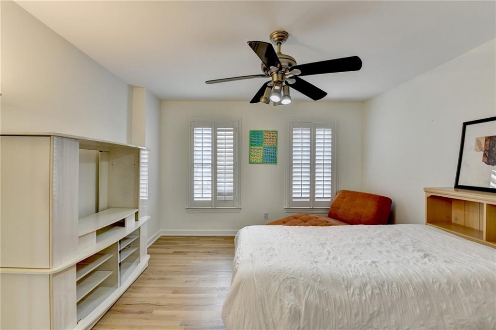 1830 Briergate Drive Duluth, GA 30097 - Photo 32 of 61 a bedroom with a large bed and a chandelier