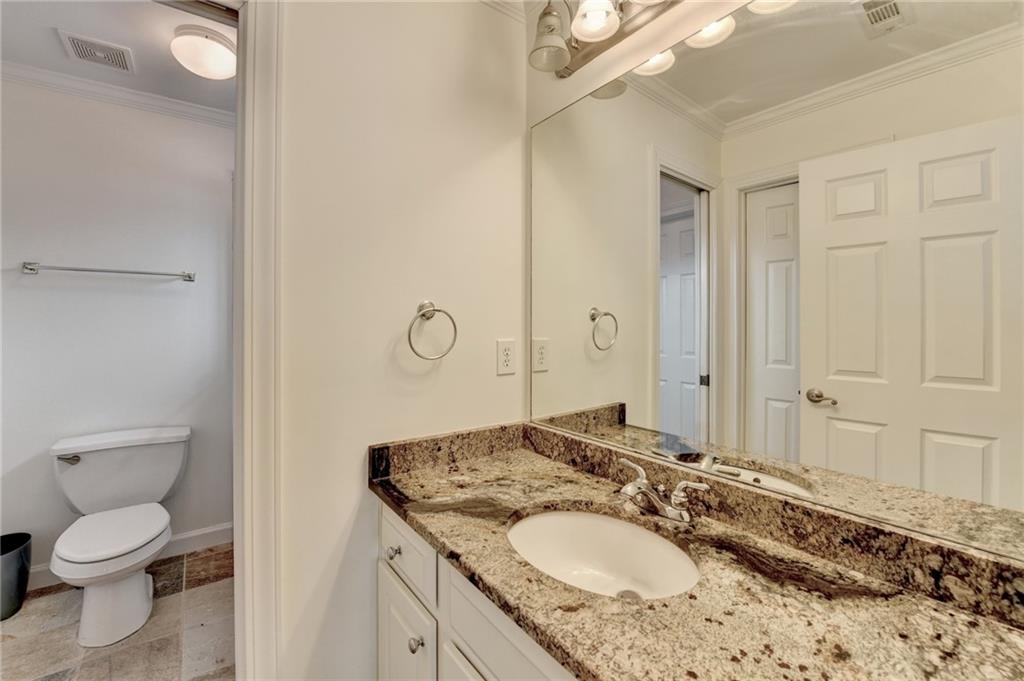 1830 Briergate Drive Duluth, GA 30097 - Photo 36 of 61 a bathroom with a granite countertop sink toilet and shower