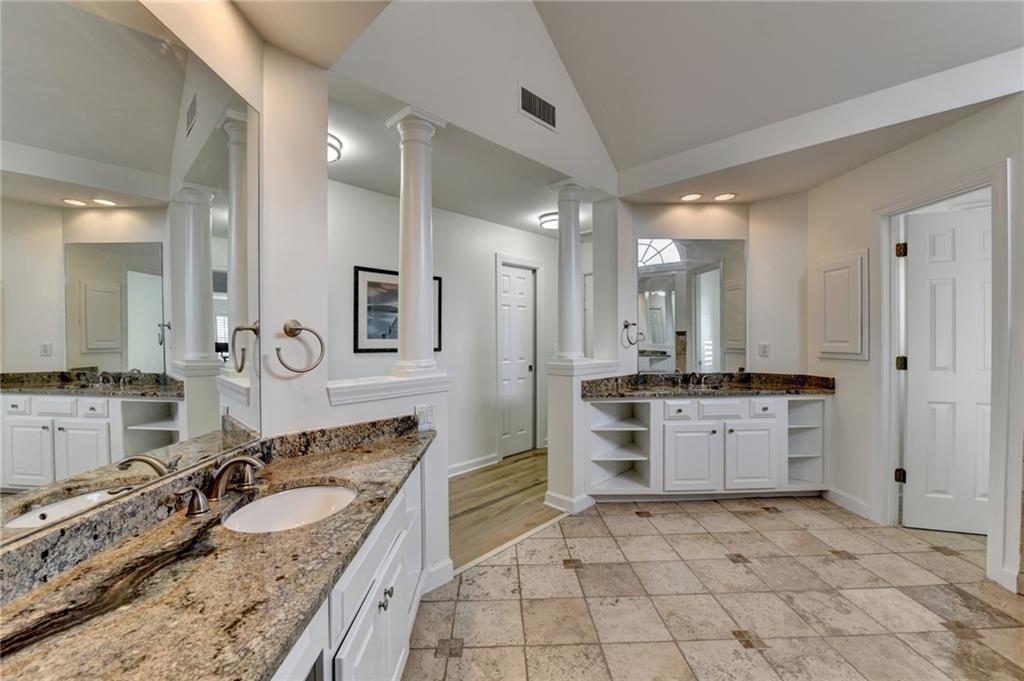 1830 Briergate Drive Duluth, GA 30097 - Photo 46 of 61 a large bathroom with a granite countertop double vanity sink a mirror and a bathtub