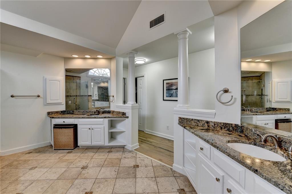 1830 Briergate Drive Duluth, GA 30097 - Photo 47 of 61 a large kitchen with granite countertop a sink and a stove
