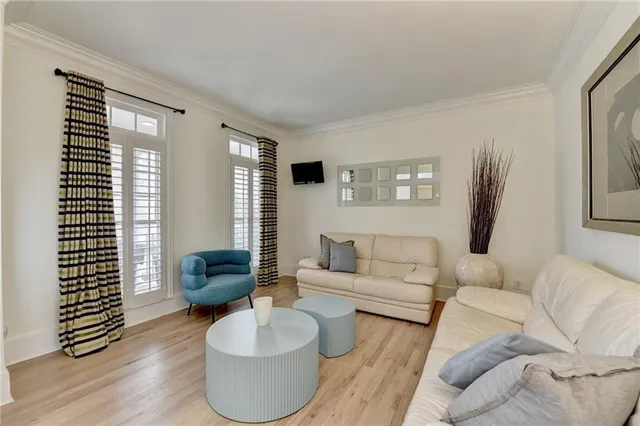 a large white kitchen with stainless steel appliances granite countertop a stove and a sink