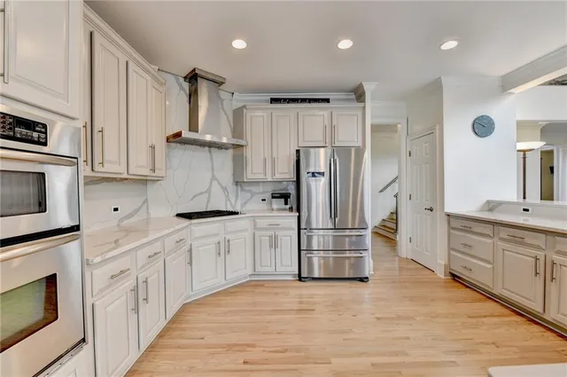 a view of a dining room with furniture wooden floor and a chandelier