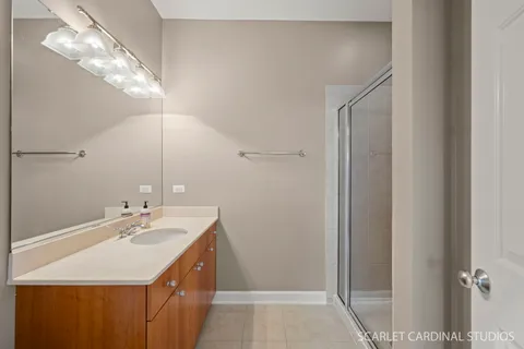 a bathroom with a sink vanity and a mirror