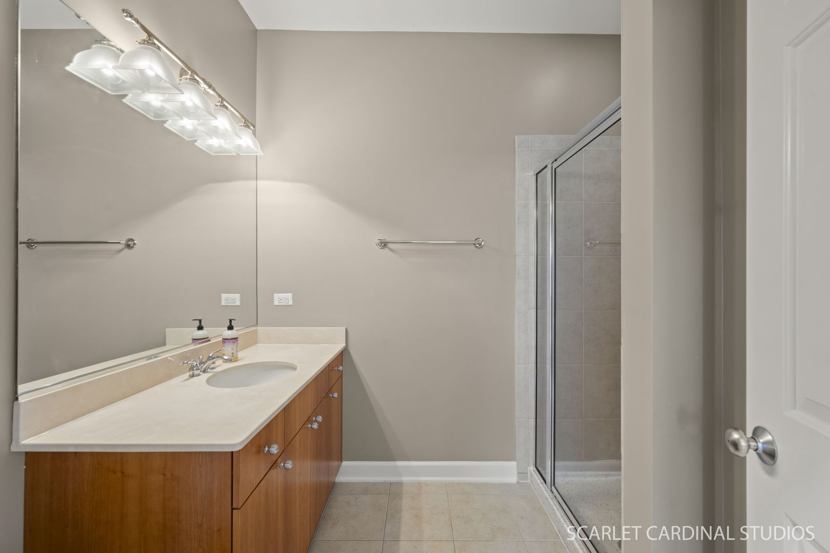 1419 West Fillmore Street, Unit 3W Chicago, IL 60607 - Photo 24 of 26 a bathroom with a sink vanity and a mirror