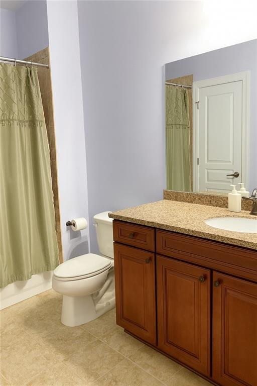 2231 Cain Commons Drive Dacula, GA 30019 - Photo 18 of 20 a bathroom with a granite countertop sink toilet and mirror