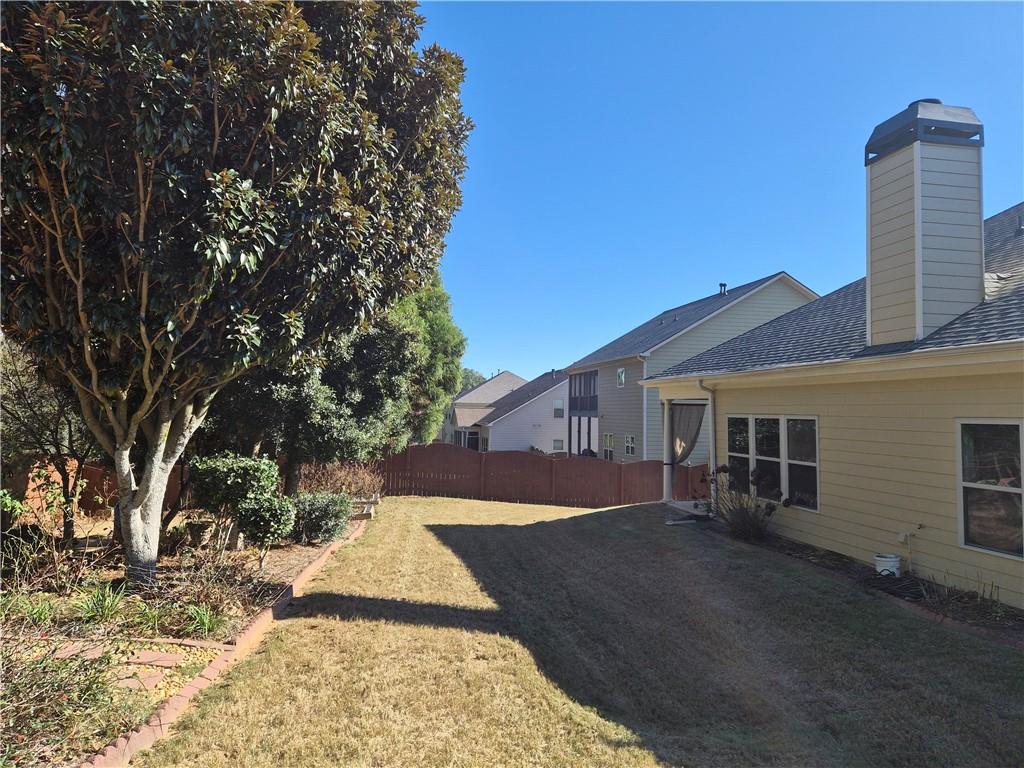 2231 Cain Commons Drive Dacula, GA 30019 - Photo 20 of 20 a view of a house with a yard