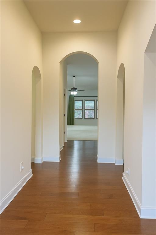 2231 Cain Commons Drive Dacula, GA 30019 - Photo 4 of 20 a view of a room with wooden floor and a window