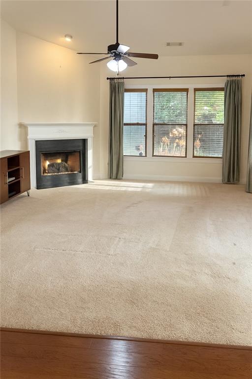 2231 Cain Commons Drive Dacula, GA 30019 - Photo 7 of 20 a view of an empty room with a fireplace and a window