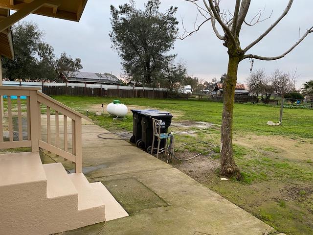 15792 Raymond Road Madera, CA 93638 - Photo 14 of 18 a view of a lake with a bench in the patio