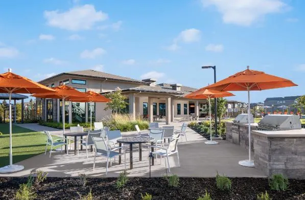 an outdoor space with furniture and umbrella