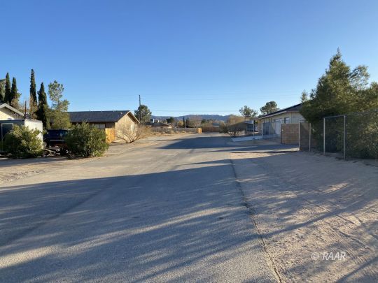 213 South Valley Street Ridgecrest, CA 93555 - Photo 7 of 8 a view of a yard and front view of a house
