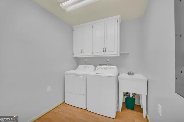 an empty room with window and ceiling fan