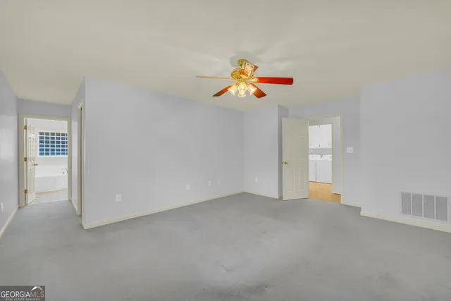 a bathroom with a granite countertop toilet a sink and bathtub