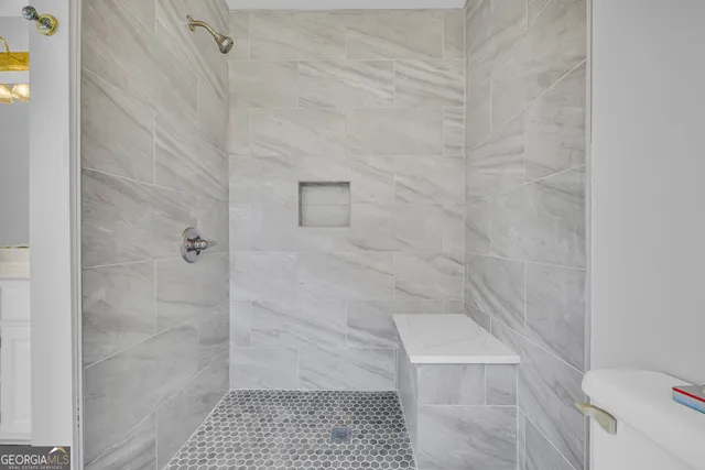a white bath tub sitting in a bathroom