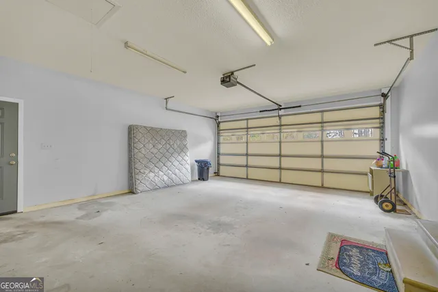 a view of a hallway with chairs