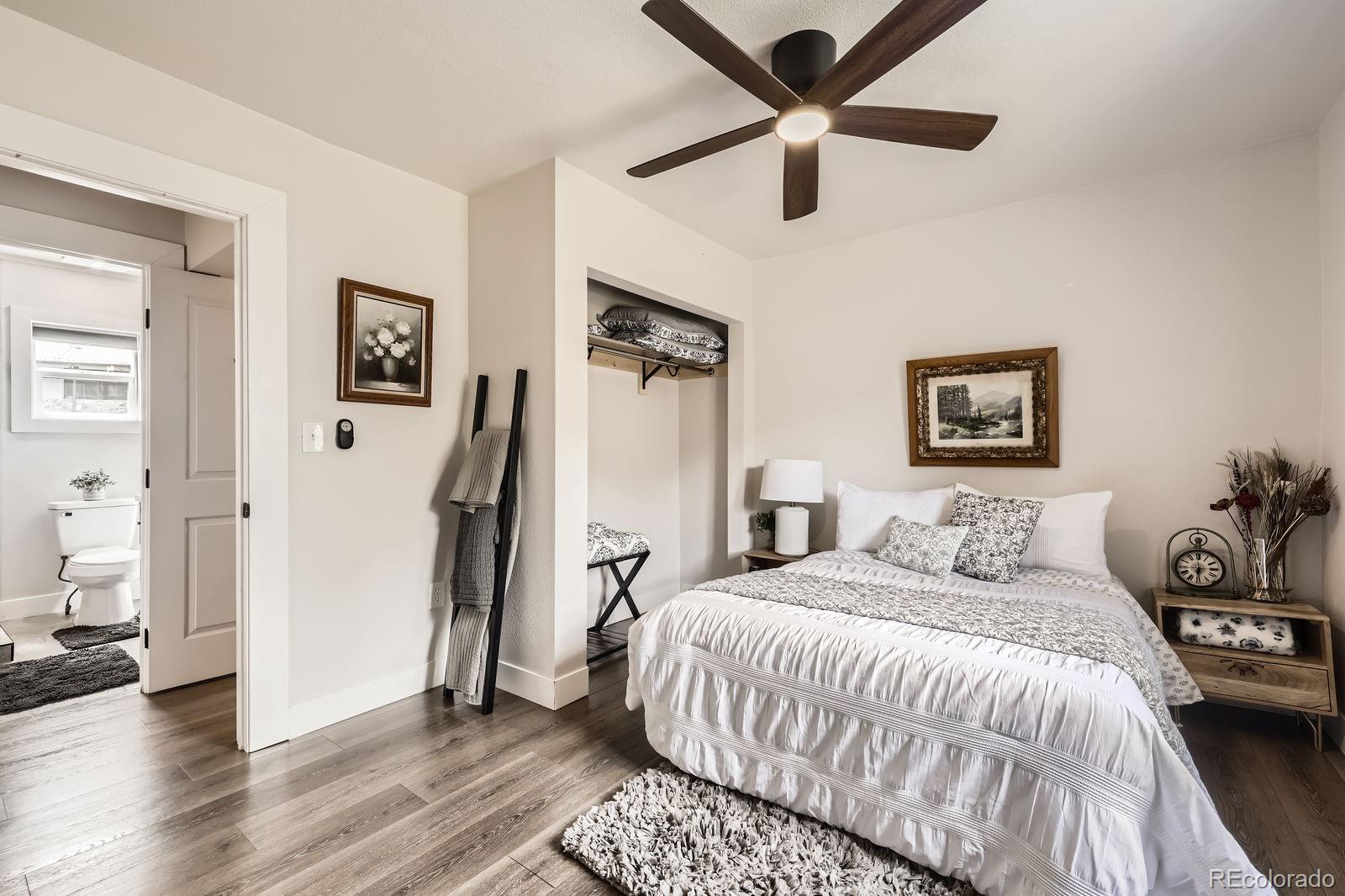 57920 US Highway 285, Unit 8 Bailey, CO 80421 - Photo 13 of 29 a bedroom with a bed and a ceiling fan