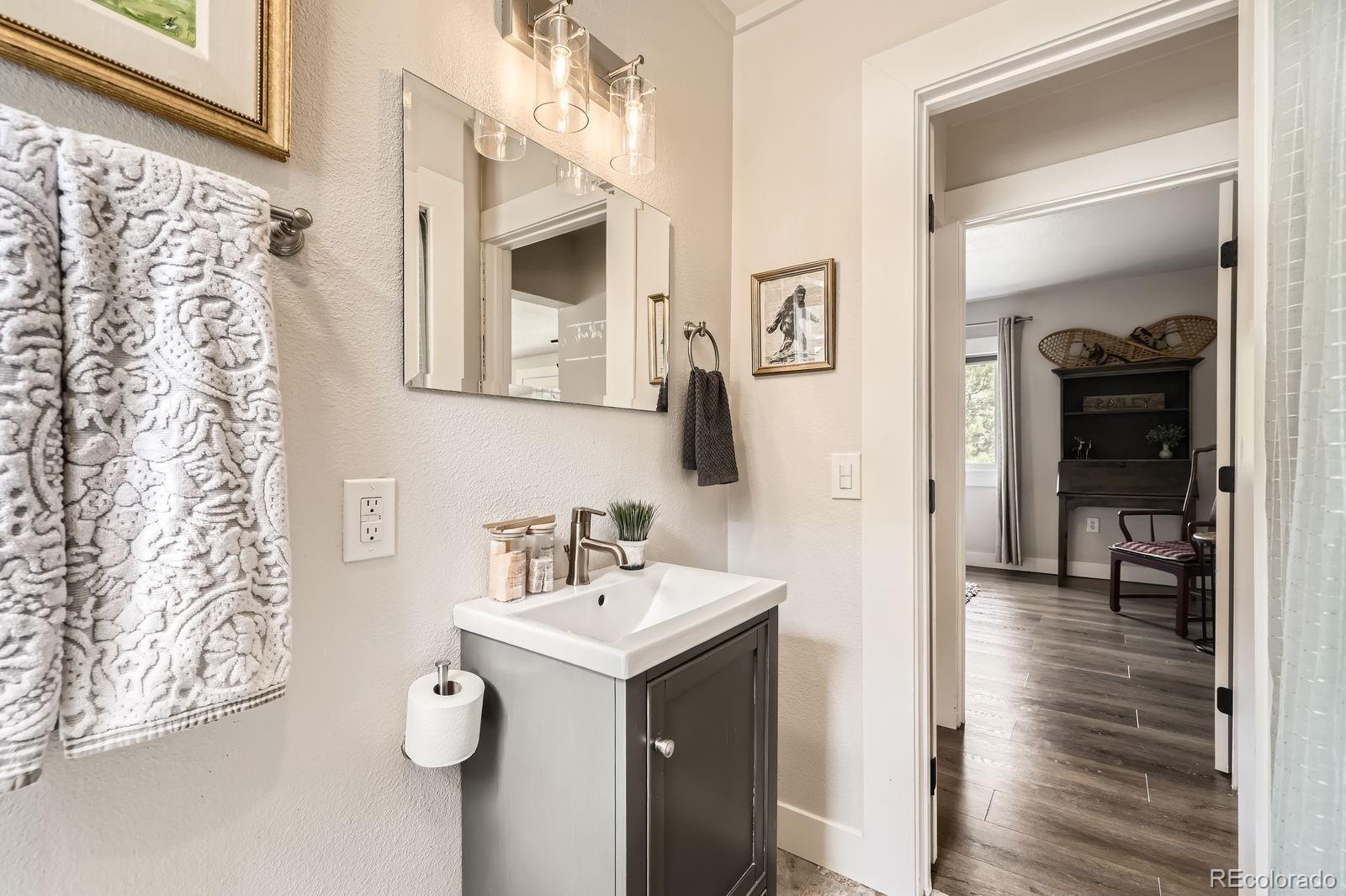 57920 US Highway 285, Unit 8 Bailey, CO 80421 - Photo 15 of 29 a bathroom with a sink and a mirror