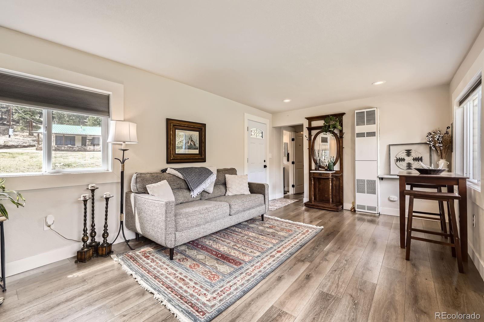 57920 US Highway 285, Unit 8 Bailey, CO 80421 - Photo 5 of 29 a living room with furniture and a table