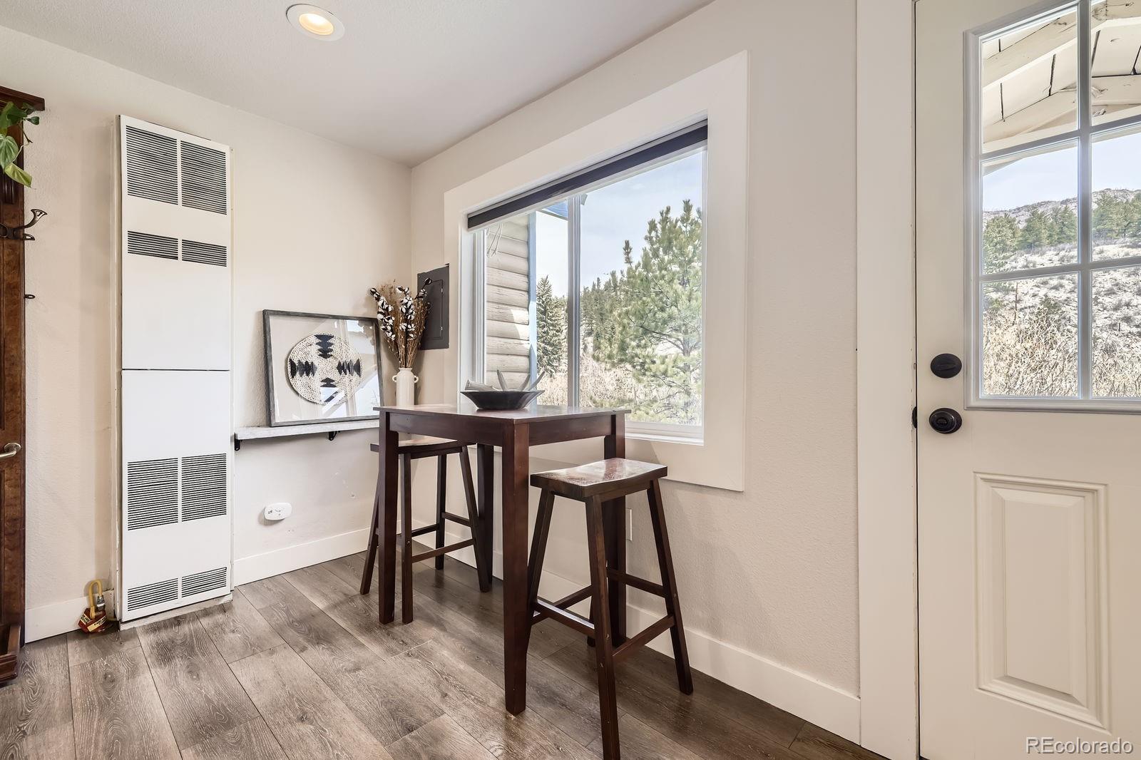 57920 US Highway 285, Unit 8 Bailey, CO 80421 - Photo 6 of 29 a view of a dining room with furniture and a window
