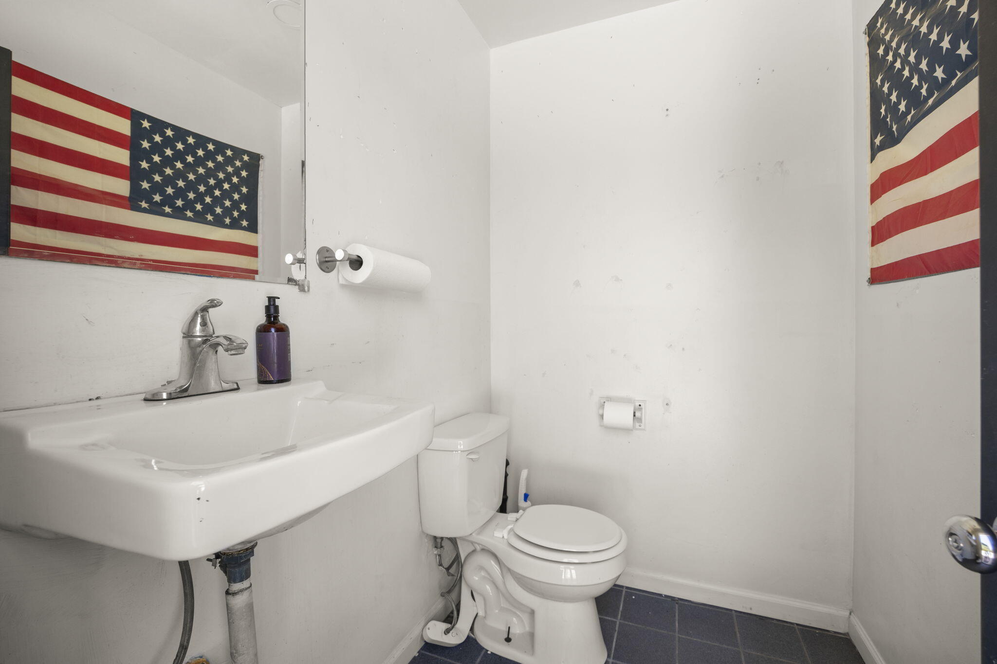 65 Baldwin Road Ojai, CA 93023 - Photo 6 of 11 a bathroom with a sink a toilet and shower curtain