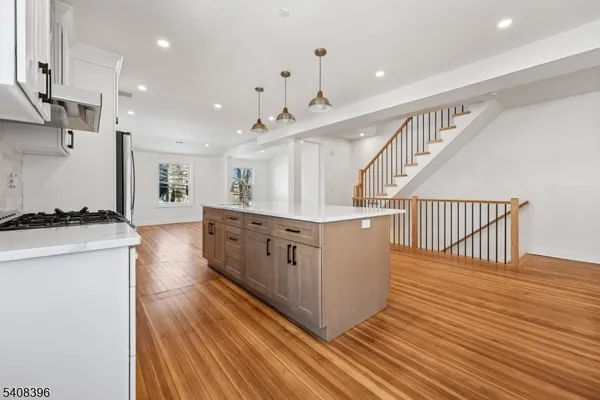 a view of kitchen with cabinets and wooden floor