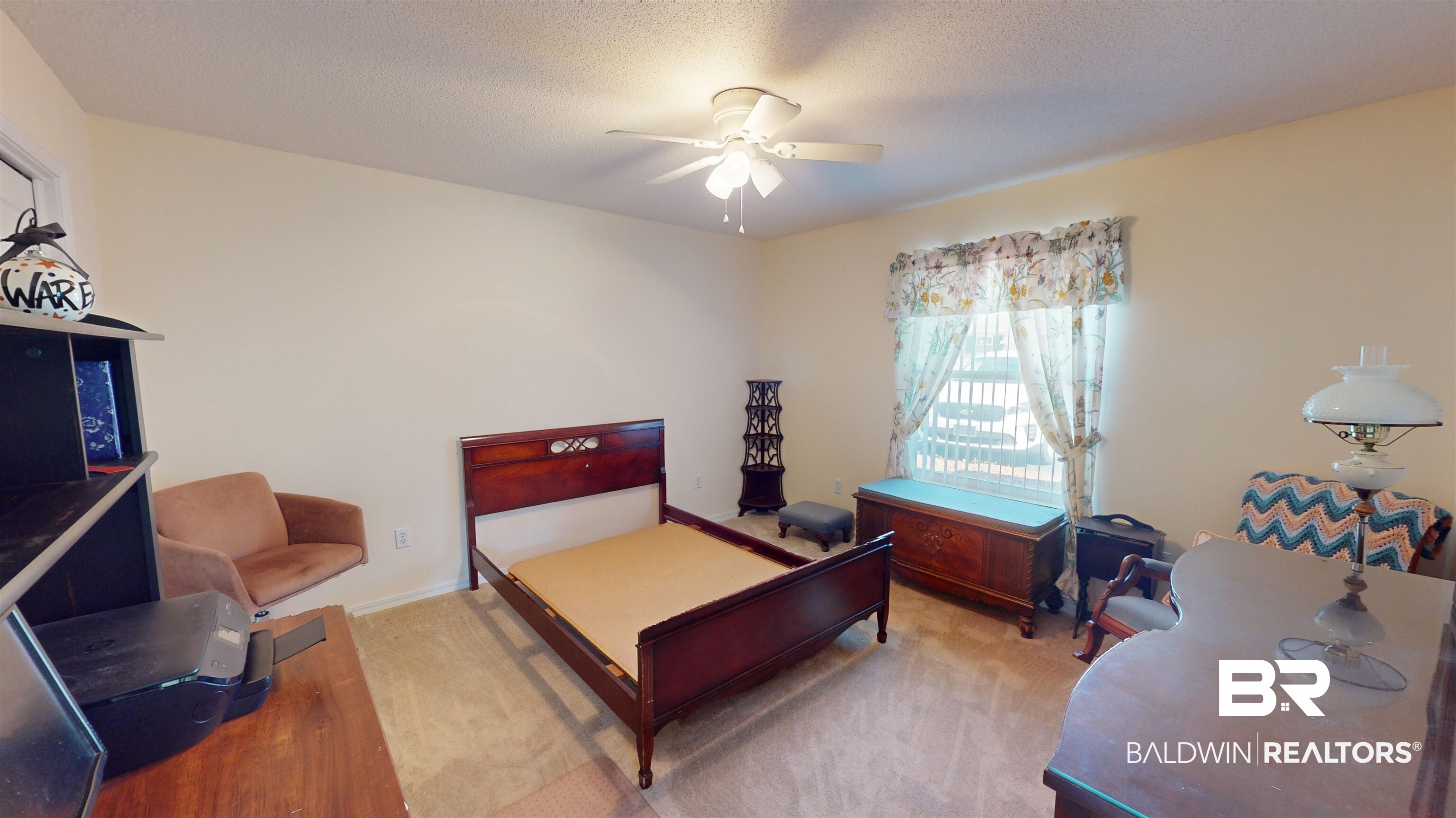 9445 Villas Drive Foley, AL 36535 - Photo 13 of 20 Carpeted bedroom featuring ceiling fan and a textured ceiling