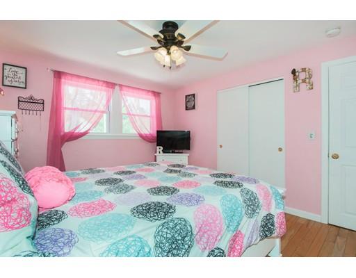 38 Old Bolton Road Hudson, MA 01749 - Photo 17 of 30 a bedroom with a bed and a chandelier
