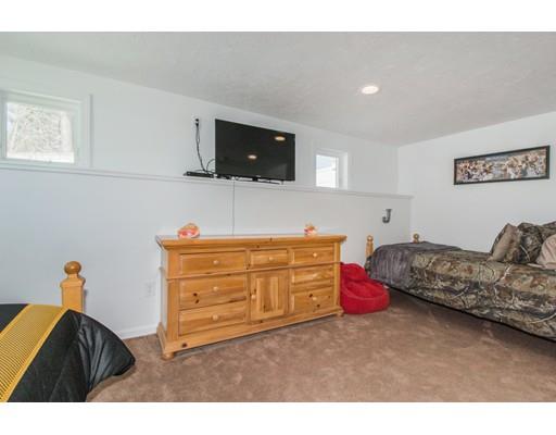 38 Old Bolton Road Hudson, MA 01749 - Photo 21 of 30 a bedroom with a bed and flat screen tv