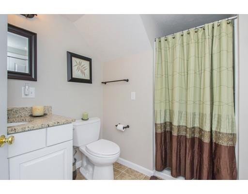 38 Old Bolton Road Hudson, MA 01749 - Photo 23 of 30 a bathroom with a granite countertop toilet sink and a mirror