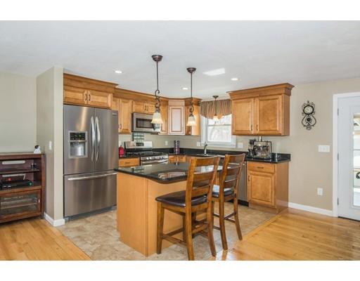 38 Old Bolton Road Hudson, MA 01749 - Photo 4 of 30 a kitchen with stainless steel appliances kitchen island granite countertop a refrigerator and a stove top oven