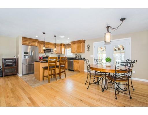 38 Old Bolton Road Hudson, MA 01749 - Photo 5 of 30 a living room with lots of furniture and kitchen view